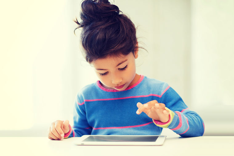 education, school, technology and internet concept - little student girl with tablet pc at home